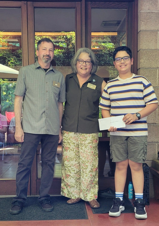 Jon Gerace and Mardie Rhodes of Sammamish Rotary with Atharv Kumaria after Rotary supported Printable Dreams with funding for a 3D printer.